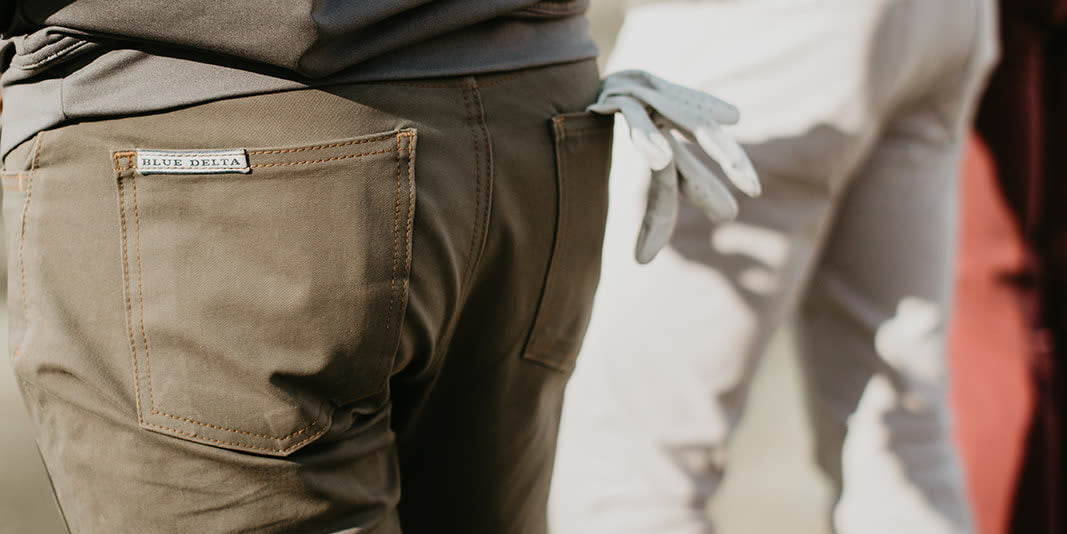 Performance pants and a golf glove, close up