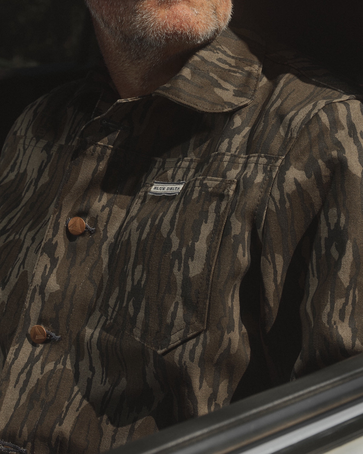 Men's Bottomland canvas jacket in the truck window