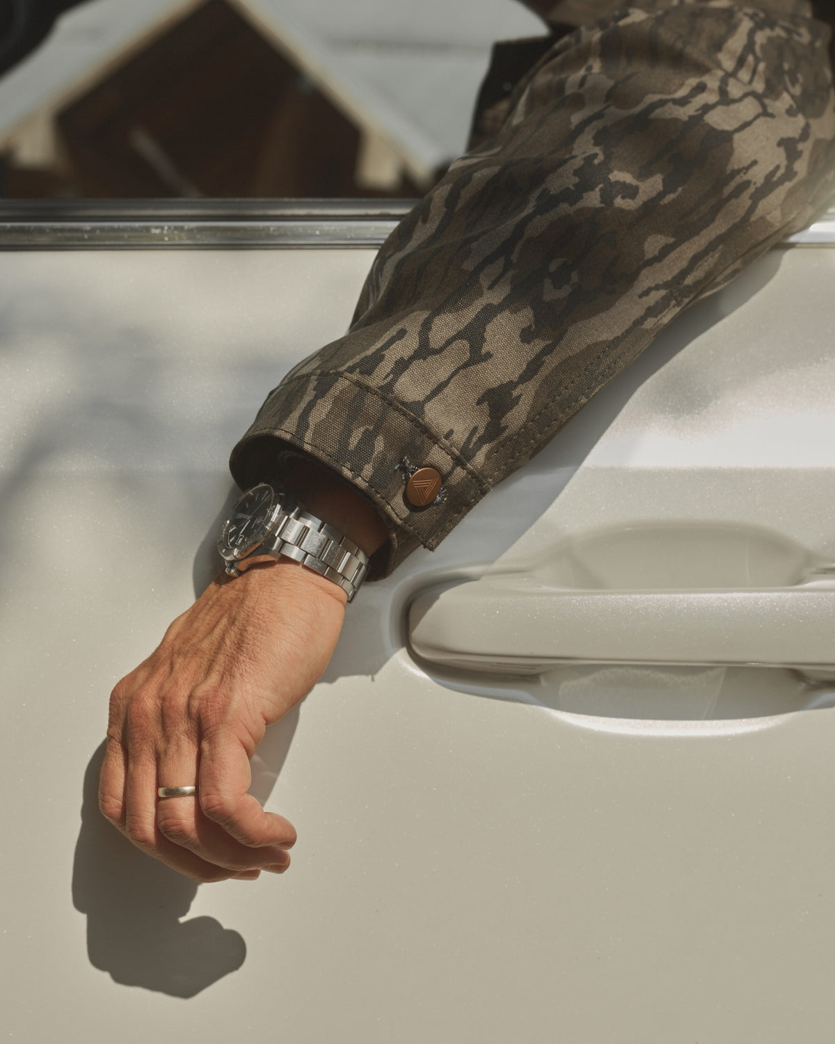 Bottomland canvas sleeve and cuff resting on a truck door