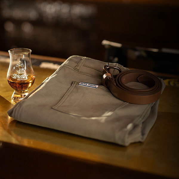 A pair of light tan custom chinos from Blue Delta Jeans, neatly folded and ready for luxury gifting.