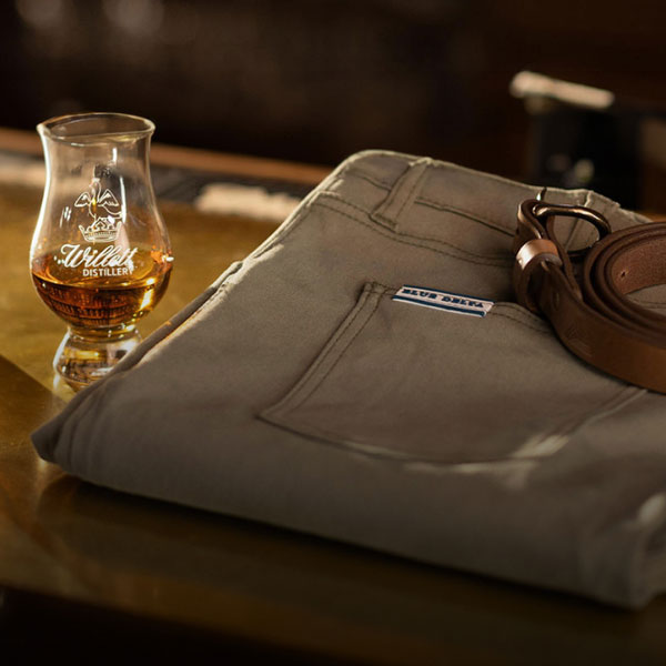 A pair of light tan custom chinos from Blue Delta Jeans, neatly folded and ready for luxury gifting.