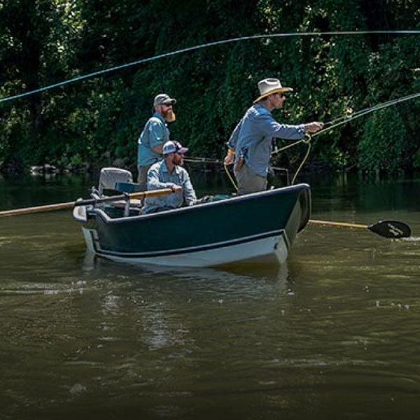 Men enjoying a luxury fly-fishing event, a unique onsite gifting experience offered by Blue Delta Jeans.