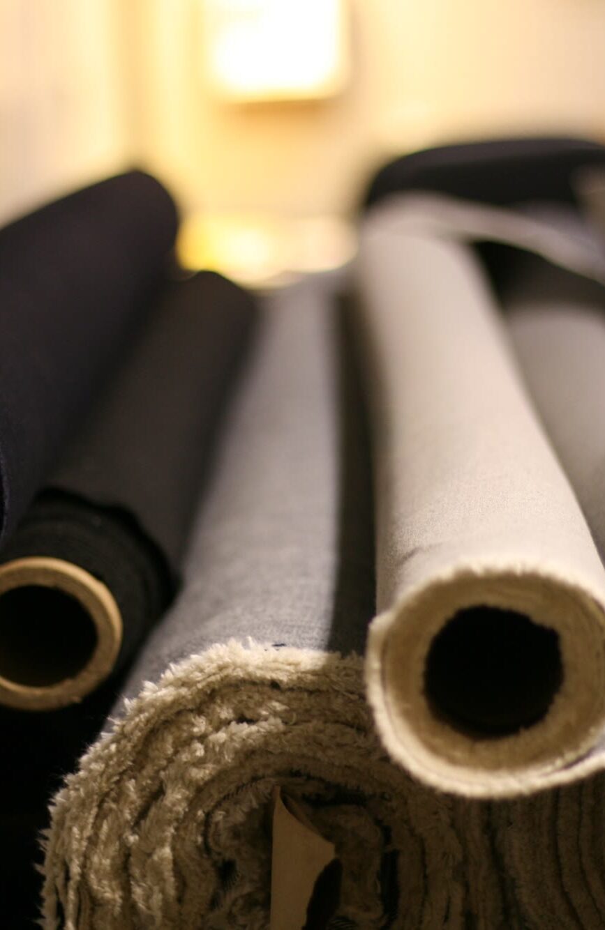 Rolls of denim and twill on the shelf