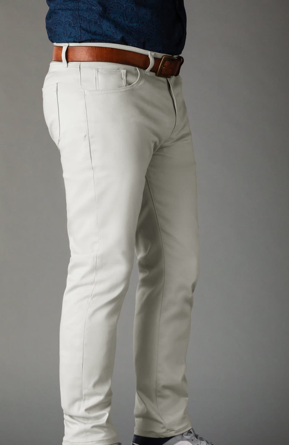 Light gray chinos with a brown leather belt