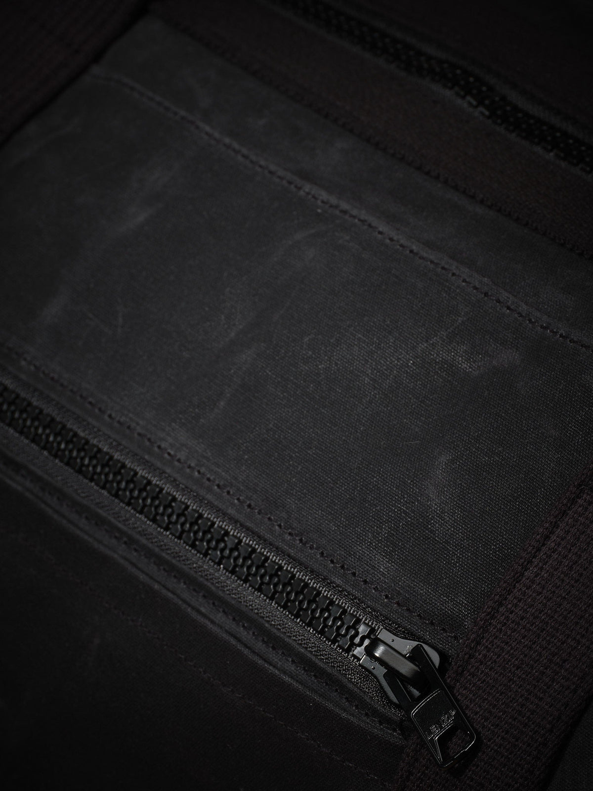 Waxed Canvas Duffle in black: zippered front pocket