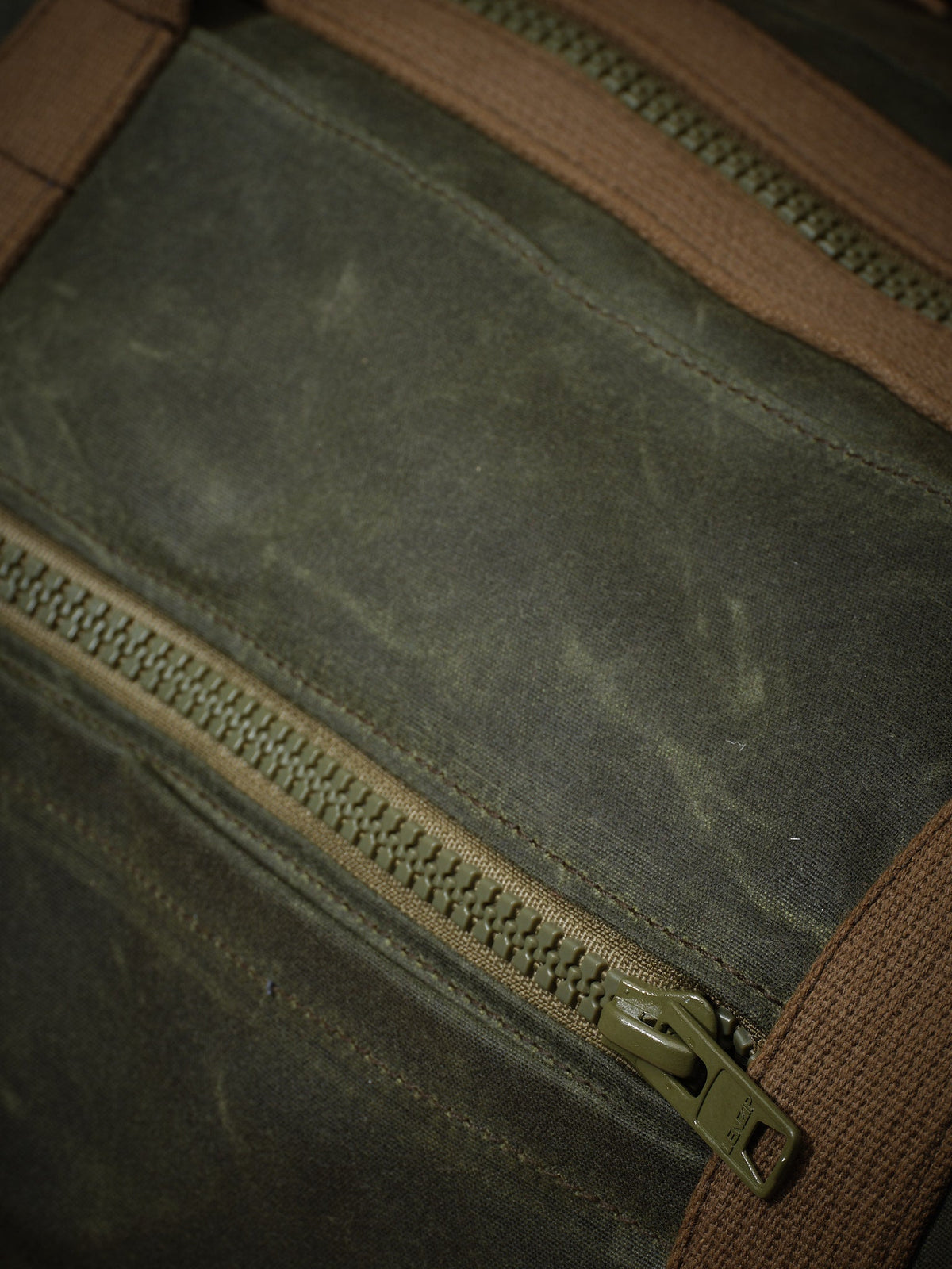 Waxed Canvas Duffle in green: zippered front pocket