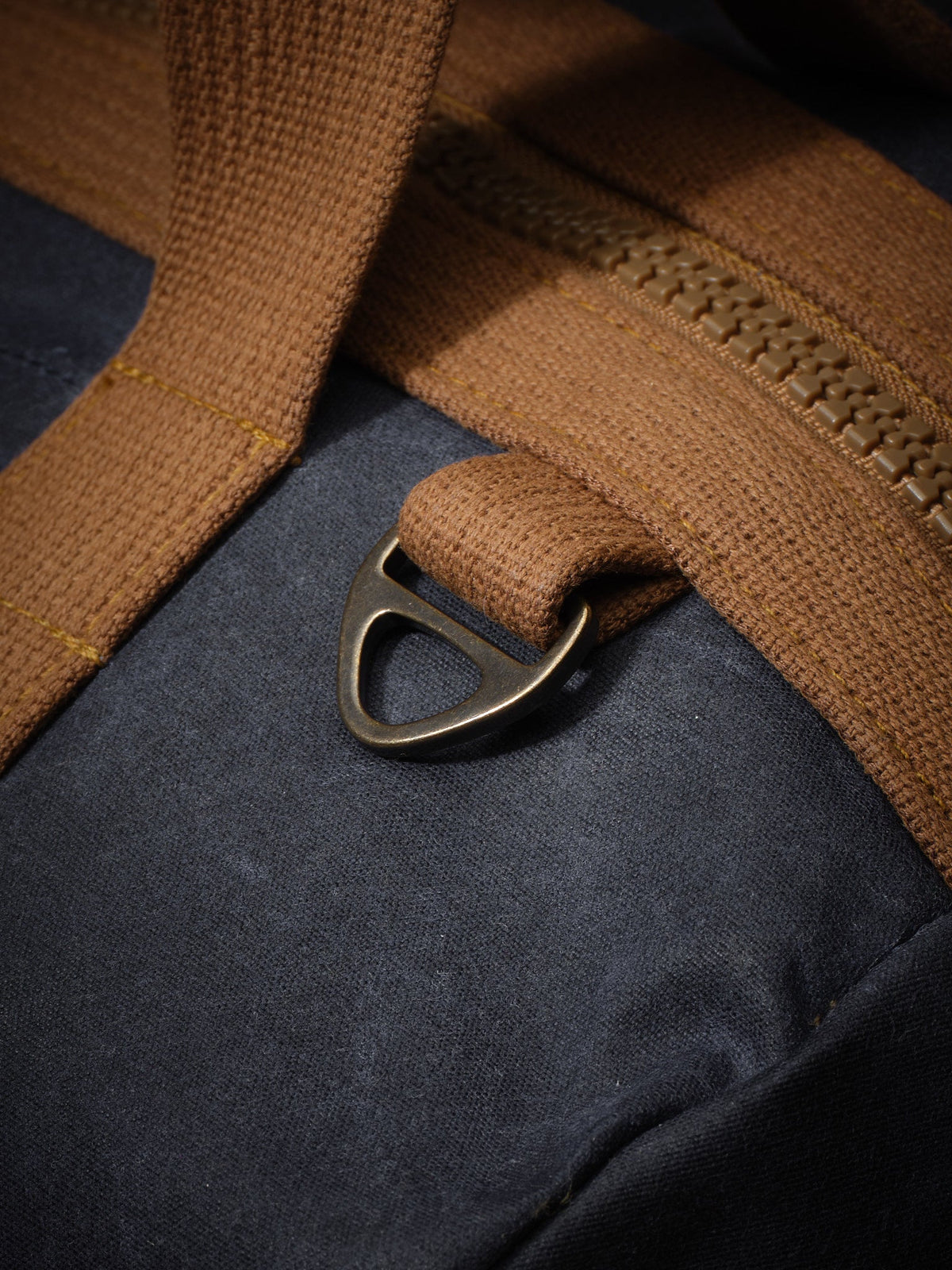 Waxed Canvas Duffle in navy: antique brass D-ring