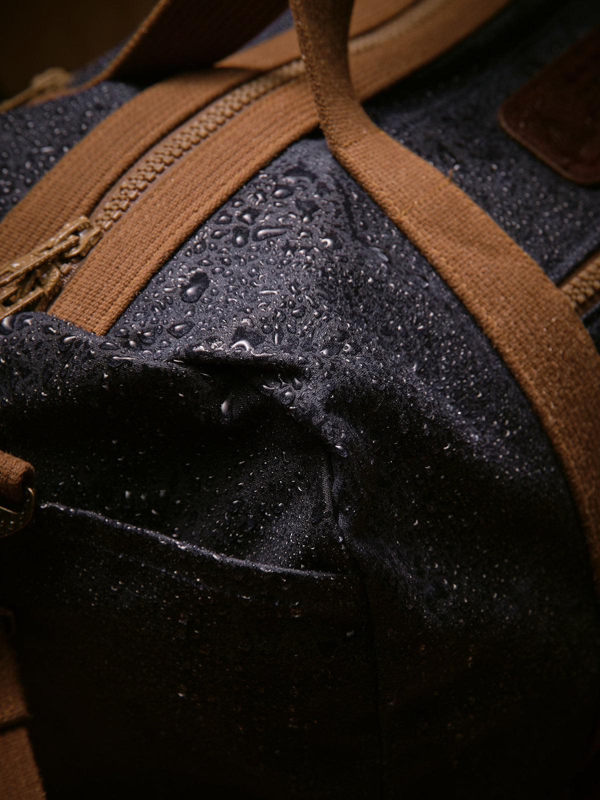Waxed Canvas Duffle in navy: water beading on the waxed canvas