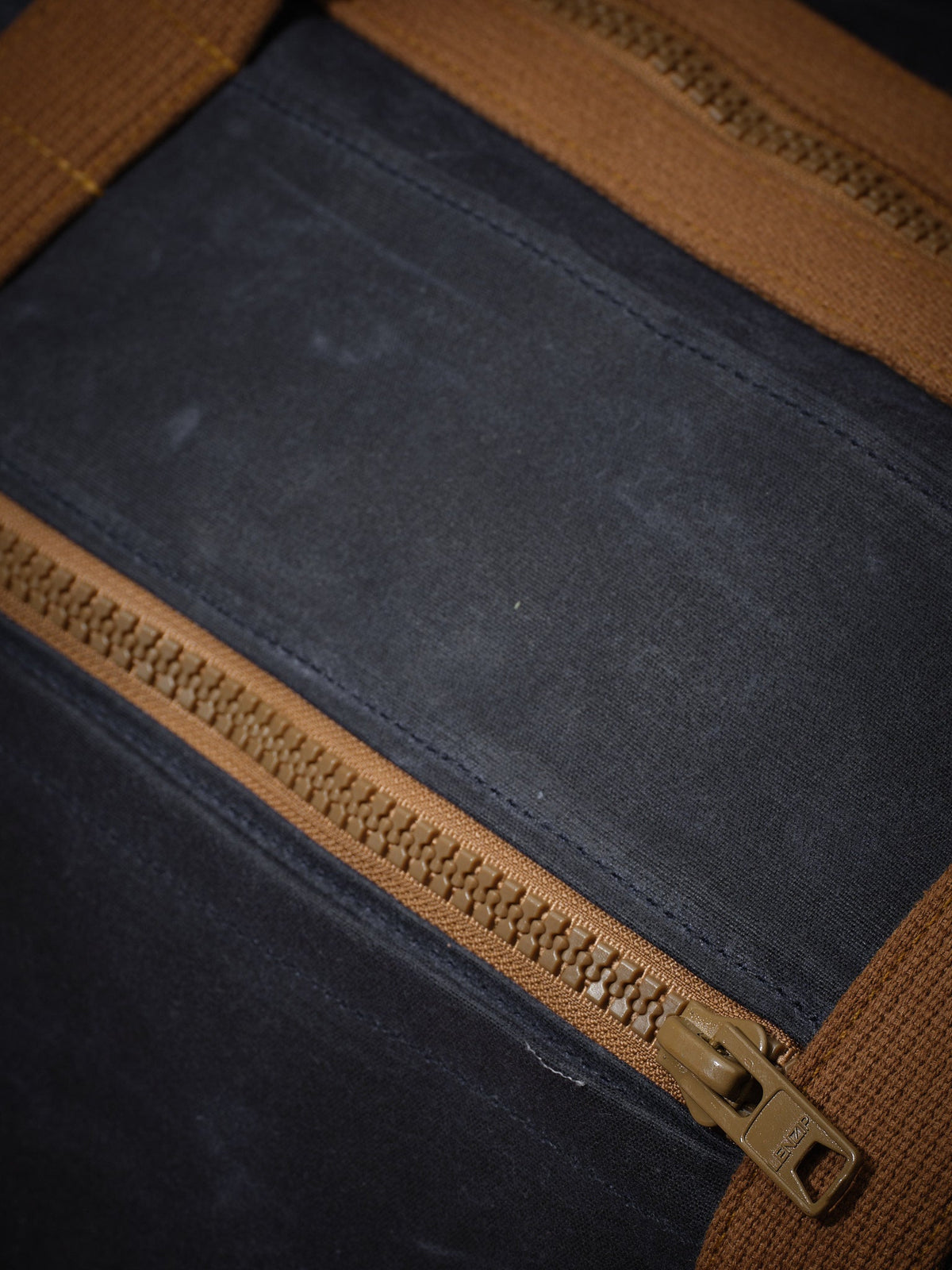 Waxed Canvas Duffle in navy: zippered front pocket