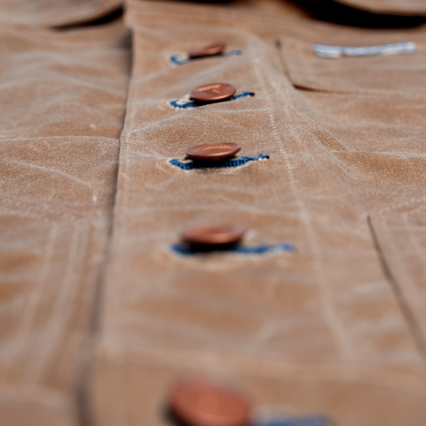 Made in the USA waxed canvas jacket button details